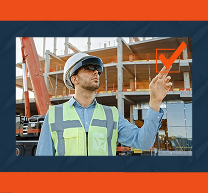 A construction worker uses augmented reality glasses on a job site.